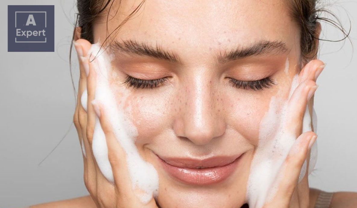 Girl cleansing her face